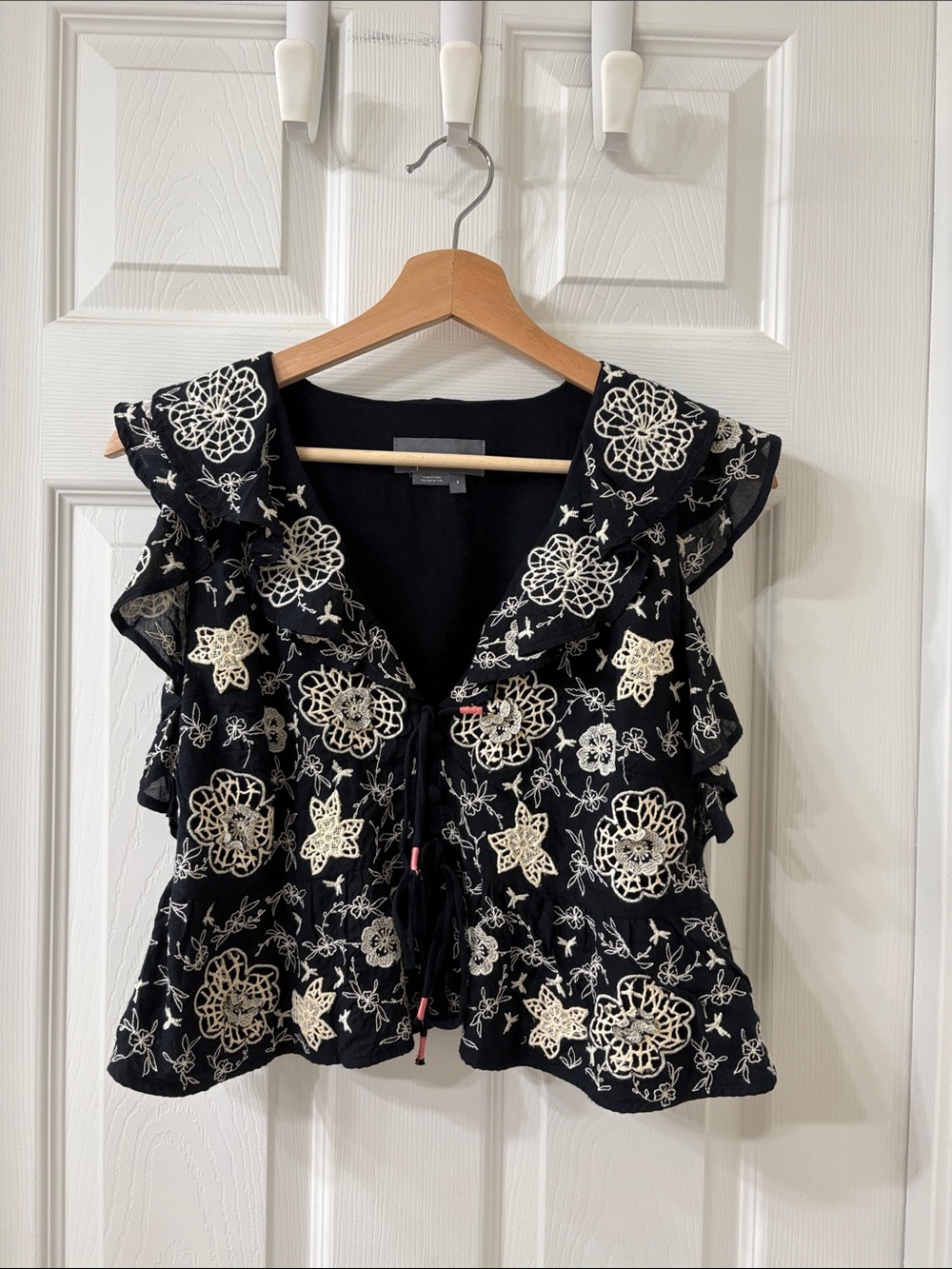 Anthropology Black Sleeveless Ruffle Top with Cream Floral Embroidery